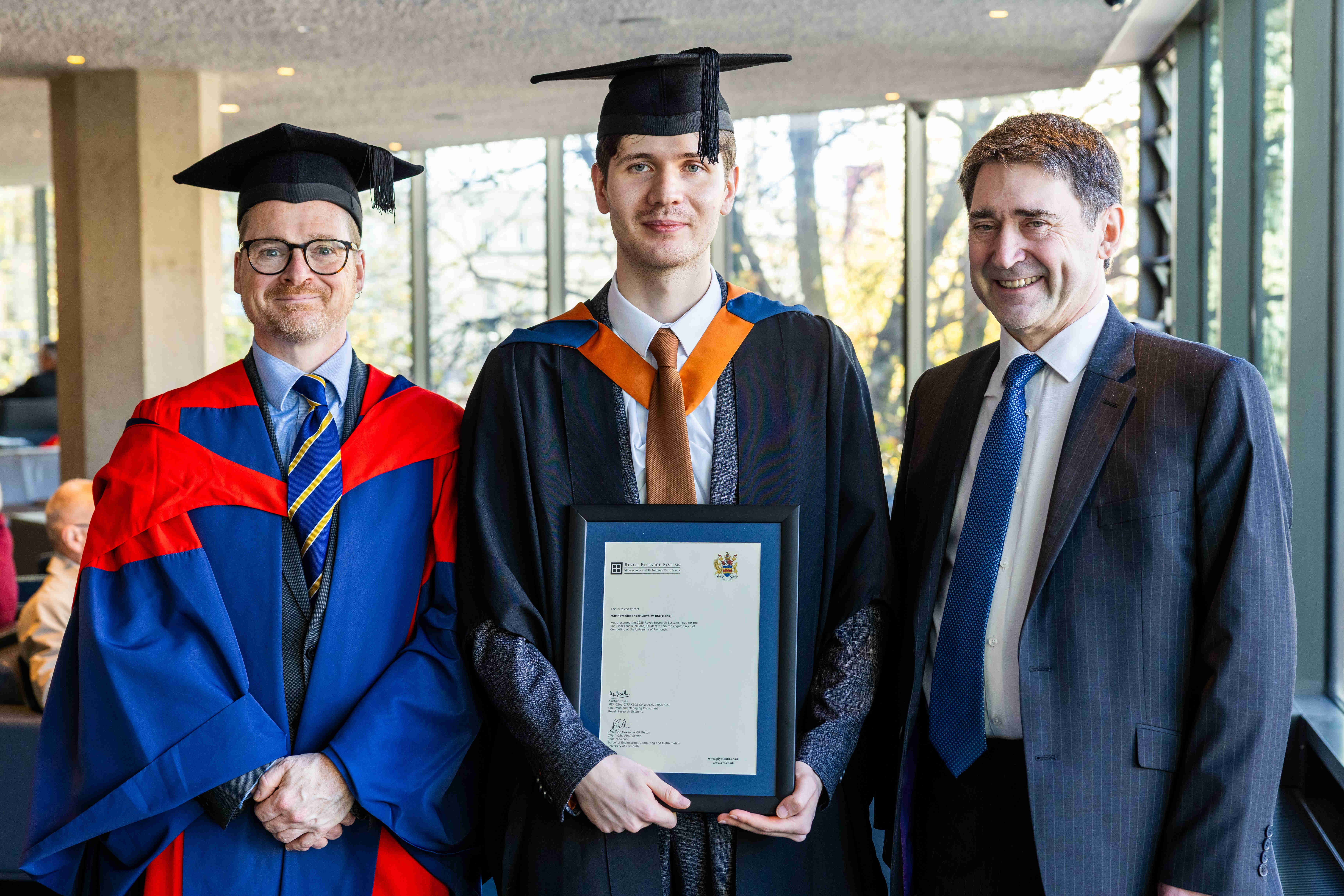 Matthew Lowsley at his graduation ceremony with Professor Alexander (left) and Belton Alastair Revell (right).