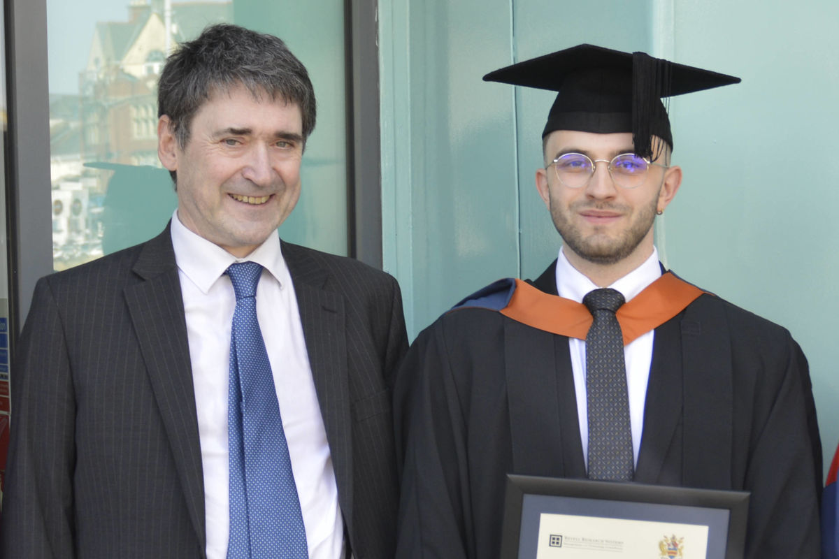 Alex Trzcinski-Draper with Alastair Revell (left)